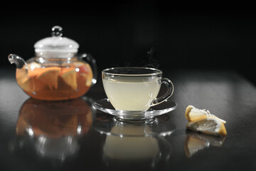 Hot drink with lemon. Hot tea with lemon. Hot cocktail with lemon.