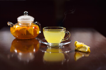 Hot drink with lemon. Hot tea with lemon. Hot cocktail with lemon.