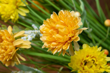 A fake yellow silk easter style flower
