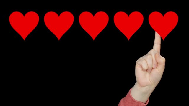 Five hearts rating feedback and human hand. Cropped shot of person pointing with finger at red hearts review on black background