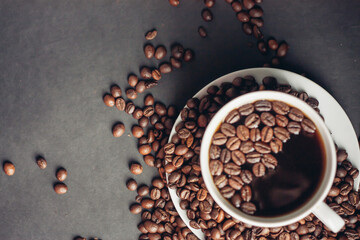 cup of coffee in female hands on a gray background morning breakfast aroma