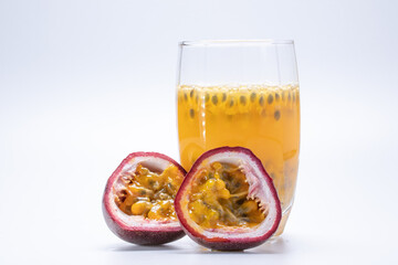 Passion fruit juice in a clear glass and fruit of passion fruit