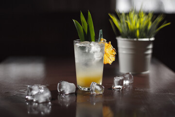 A cold cocktail standing on the table.