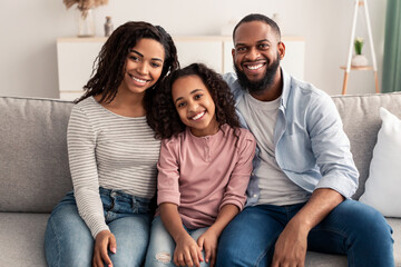 Portrait of a happy black family smiling at home