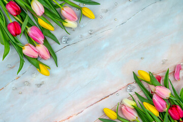 Tulips on a marble surface. Floral background with copy space for placing text for the design of...