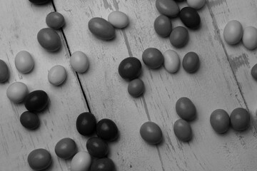 Top view of chocolate balls background.Black and white creative photography style ,sweets and candies background.