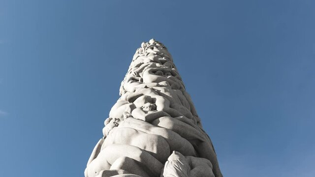 The Monolith (Monolitten) Stone Pillar Sculpture By Gustav Vigeland At Vigeland Facility In Frognerparken, Oslo, Norway. - low angle, hyperlapse