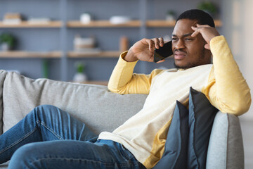 Upset black guy having conversation on phone