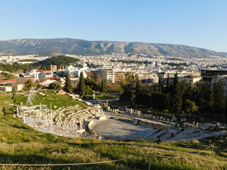January 2019, Athens, Greece. View of the ancient theater of Dionysus, on the south slope of the Acropolis, and the city