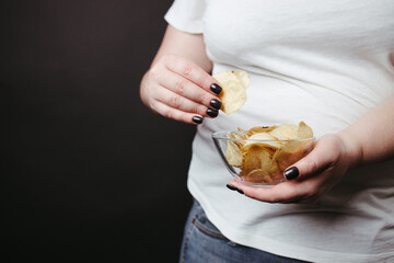 Overweight woman eat unhealthy fattening junk food