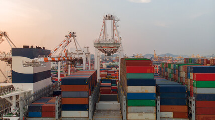 crane loanding cargo container to container ship in the international terminal yard port  concept...