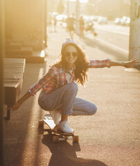 crazy hipster girl riding a skateboard