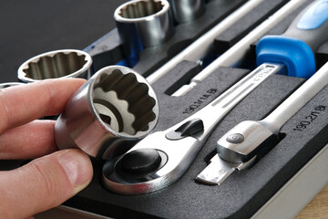 A set of auto mechanic tools. Tools: head crank, ratchet, imbus keys.