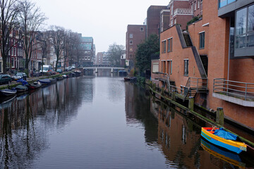   Along the canal walk citizens and moving vehicles