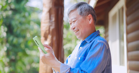 asian retired man use smartphone