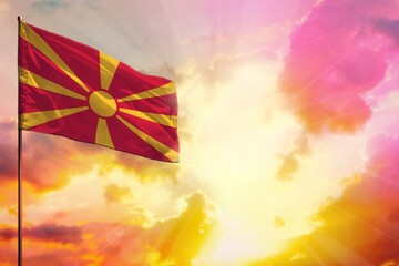 Fluttering Macedonia flag in top left corner mockup with the space for your text on beautiful colorful sunset or sunrise background.
