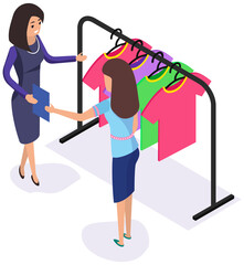 Woman communicating with consultant in shop while shopping. Clothes on hanger for sale in store