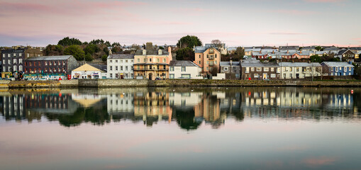 Scenic view of the harbor of Kinsale in the county of Cork, Ireland with low tide at sunset