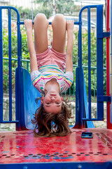 cute happy beautiful natural teenage girl in striped light t-shirt and pink shorts on the...
