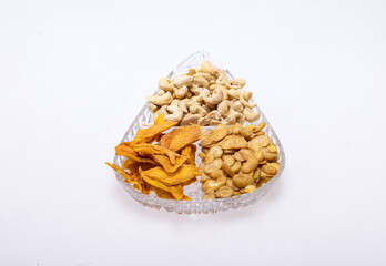 Roasted and salted fava beans, cashew nuts and dried mango slices for a healthy vegan and vegetarian diet snack. High in protein, vitamins, dietary fibre and nutrients