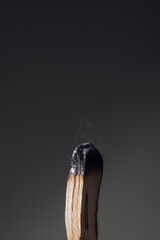 Burning palo santo stick on dark background close-up. Antistress and relaxation ritual concept