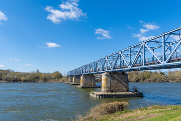 Fototapeta na wymiar Blue steel old steel bridge on Loire river in France