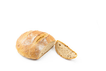 Freshly baked bread with a cut slice on a white background