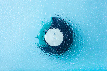 asthma inhaler medicine through water drop background. bronchial disease medical treatment