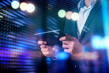Smart businessman typing data on tablet mobile phone with futuristic technology ideas background,...