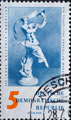 GERMANY, DDR - CIRCA 1960  : a postage stamp from Germany, GDR showing a mask dancer Design: Paul Scheurich 1933. 250 years of Meissen porcelain manufacture