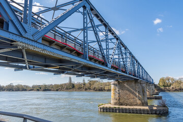 Blue steel old steel bridge on Loire river in France