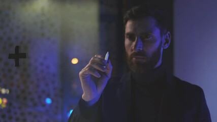 Portrait businessman use pencil write on transparent screen look at camera. Communication network. Digital transformation, analytics, connection, notes, programming, virtual reality. Slow motion - Powered by Adobe