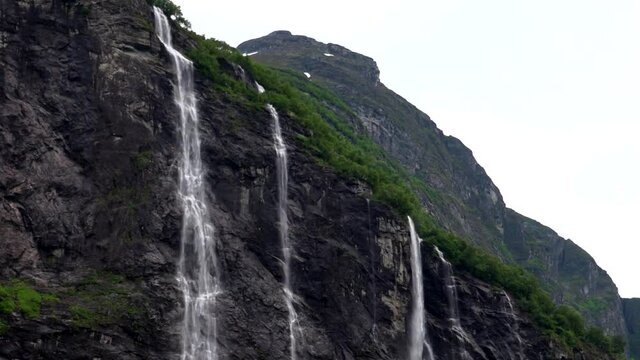 Sailing  close to Fjords mountains and beautiful waterfalls.