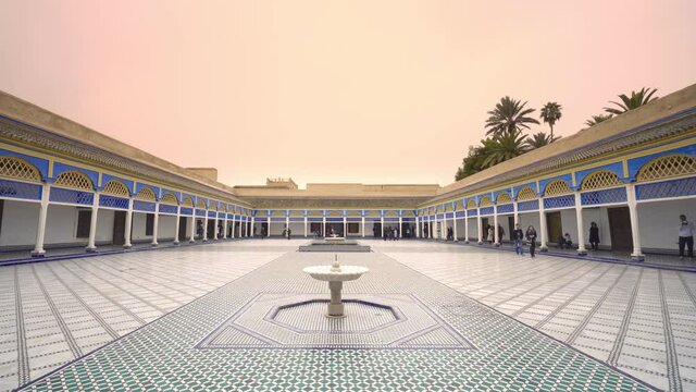 Bahia Palace in Marrakech, Morocco during sunset. Red sky, tourists, el Bahia, summer, sunset. 4K Video Footage