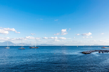 Sailboats and catamarans on the bay of Naples, Italy