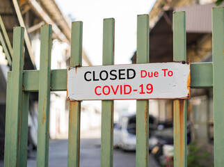  closed sign outside a restaurant, store, office or other outdoor