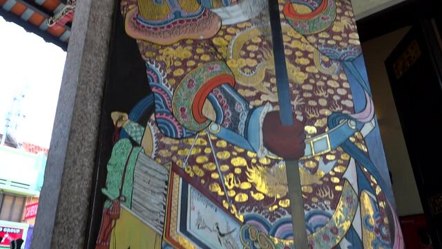 Colorful asian ancient painting on a door of Penang temple.