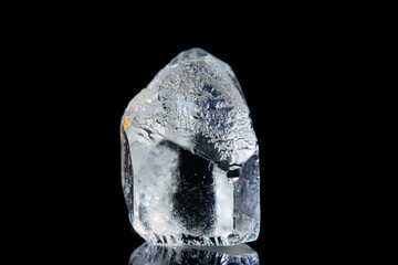 Macro stone mineral Goshenite beryl on a black background