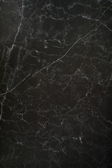 Ceramic porcelain stoneware tile texture or pattern. Natural stone black color with veining