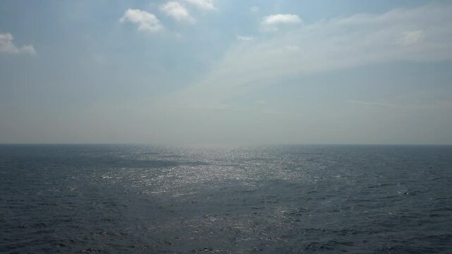 Sailing on Atlantic ocean in clear blue sky day.
