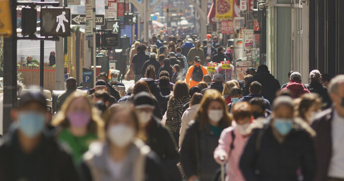 Anonymous Crowd Of People Walking Street Wearing Masks During Covid 19 Pandemic In New York City