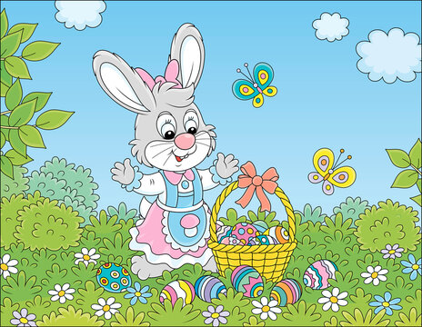 Happy Easter bunny with a decorated basket of colorfully painted eggs among flowers and merry flittering butterflies on a pretty green lawn on a beautiful and warm spring day, vector cartoon