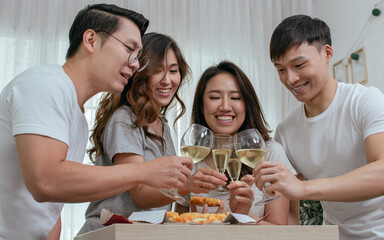 Asian people make a toast in the party at home