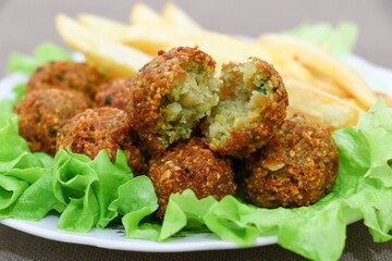 Close-up of delicious Falafel balls. Fresh vegetarian falafel with French fries. Food background