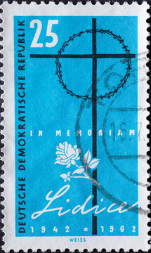 GERMANY, DDR - CIRCA 1962 : a postage stamp from Germany, GDR showing a cross with a crown of thorns, a rose and the lettering Lidice. 20th anniversary of the destruction of Lidice