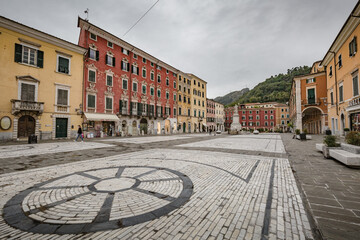 Cityscape. Carrara city center: Piazza Alberica with the commemorative monument in the center and...