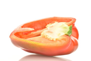 One half of red sweet pepper, close-up, isolated on white.