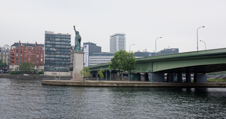  The swan island became a haven for a smaller Statue of Liberty. The copper lady, 11.5 meters high, peers at the distant shores of the American continent