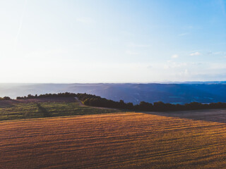 Picturesque terrain with valleys and blue sky