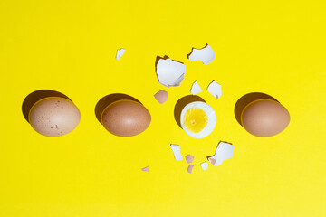 hard-boiled eggs on a yellow surface